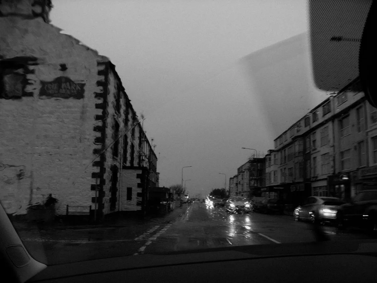 A wet London street at night